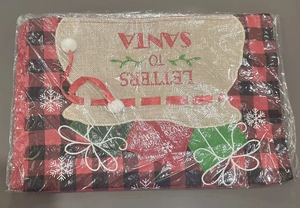 Close-up of Christmas gift bag featuring red buffalo plaid and Letters to Santa text
