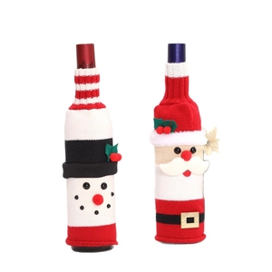 Christmas snowman and Santa Claus knitted wine bottle covers for holiday table decoration