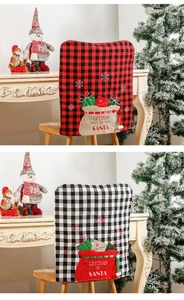 Close-up of Christmas chair covers with Buffalo plaid and Letters to Santa embroidery