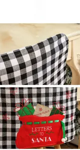Detail of Christmas buffalo plaid chair cover with Letters to Santa pocket and embroidery