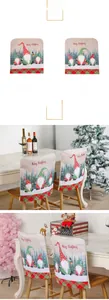 Detail of Christmas gnome chair covers with Merry Christmas text and red green plaid trim