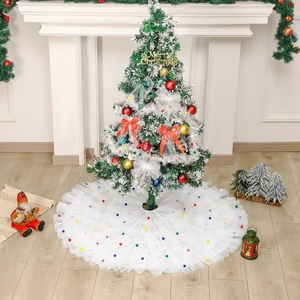 Elegant white layered tulle Christmas tree skirt with colorful pom poms and ruffles