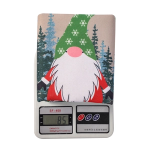 Detail of Christmas gnome chair cover on a digital scale showing 85g linen fabric weight