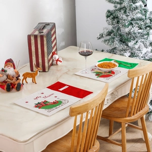 Christmas themed placemat set with Merry Christmas text and festive gift box patterns