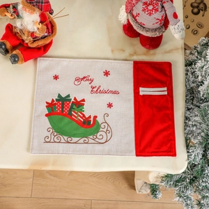 Christmas place mat with red sled and Merry Christmas embroidery on beige fabric