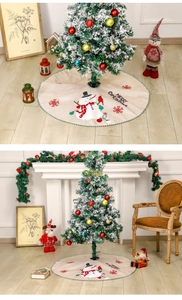 Close-up and lifestyle view of faux linen Christmas tree skirt with snowman and merry text
