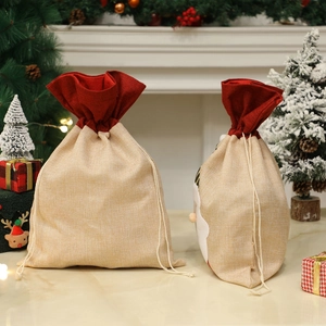 Sac cadeau de Noël en toile de jute avec motif Père Noël et bordure en lin rouge