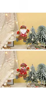 Detail of Christmas plush ornaments featuring Santa and Snowman with red plaid fabric