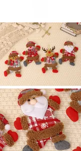 Macro shot of plush Santa ornament detailing fabric textures and Christmas tree string