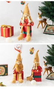 Close-up of Christmas gnomes with pointed ginger hats and long legs on faux fur rug