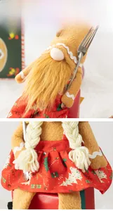 Close-up of gingerbread plush dolls with festive red patterns and white wave ribbon trim