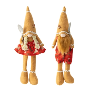 Pair of Christmas gingerbread gnome dolls with pointed hats and soft festive textures