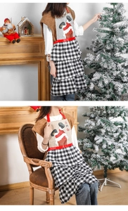 Christmas apron detail featuring Santa chimney print and tiered black-white checkered hem