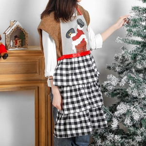 Christmas apron with Santa chimney print and black-and-white checkered ruffled skirt