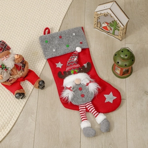 Red Christmas stocking with 3D gnome decoration and grey cuff with colorful buttons
