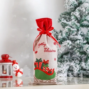Linen Christmas wine bottle bag with red ribbon and Merry Christmas sleigh pattern