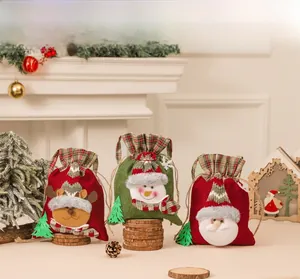 Three-piece set of Christmas drawstring gift bags featuring elk, snowman, and Santa designs