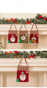 Detail of Christmas drawstring gift bags featuring 3D Santa, Snowman and Reindeer applique