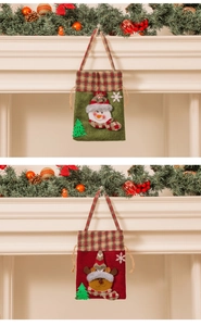 Detailed view of handmade felt Christmas gift bags with snowman and reindeer embroidery