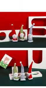 Three Christmas gnomes set with knitted hats and white fiber beards in red green and grey