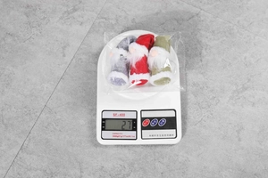 Three plush Christmas gnomes in grey, red and green weighing 27g for holiday decor