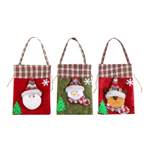 Christmas gift bags with Santa, snowman and elk designs on red and green plaid fabric