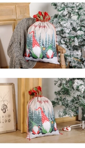 Detail of burlap Christmas gnome gift bag with drawstring closure and festive patterns