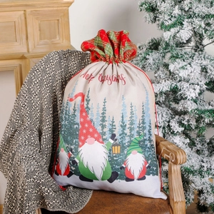 Drawstring Christmas gift bag with gnome patterns and festive Merry Christmas lettering