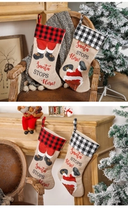 Detail of Christmas stockings with Santa chimney design and red black plaid cuffs