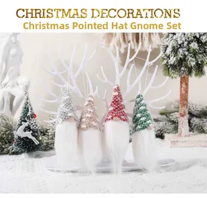 Set of four knitted Christmas gnome ornaments in festive colors on a white display