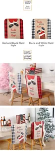 Detail of Christmas chair covers with Santa chimney print on red black plaid linen