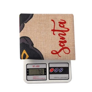Close-up of Santa print chair cover showing 78g weight on digital scale