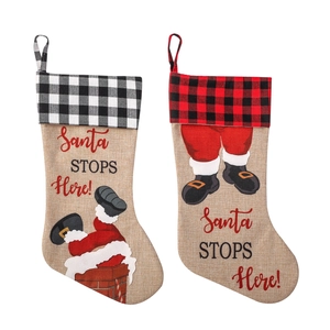 Set of burlap Christmas stockings with Buffalo Plaid cuffs and Santa Claus illustration