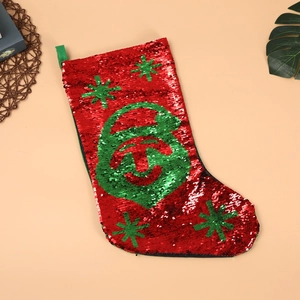 Calza di Natale in paillettes rosse e verdi con motivo a faccia in paillettes reversibili