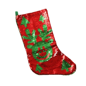 Christmas stocking with red and green reversible sequins featuring reindeer and tree patterns