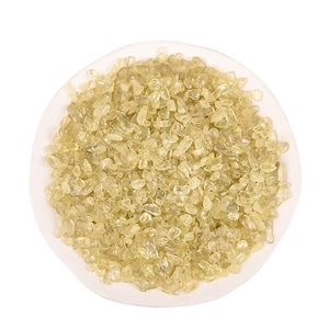 Polished Citrine tumbled stones for crystal healing and fish tank decoration in a white bowl