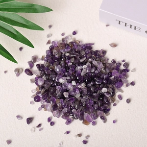 Natural amethyst crystal stone for aromatherapy and home decor on a light background