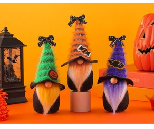 Close-up of Halloween gnomes with candy icons and plush beards on bright orange background
