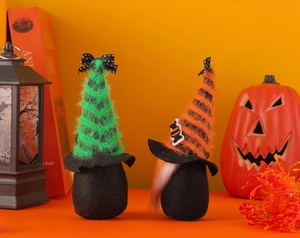 Detail of Halloween gnome plush dolls with colorful hats and long white beard on festive background