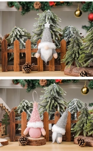 Detail of knitted Christmas gnomes with glitter stars in festive holiday scene