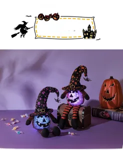 Close-up of glowing Halloween pumpkin plush dolls with LED lights and wizard hats