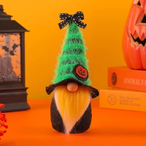 Halloween gnome decoration with green faux fur hat and yellow beard on orange background