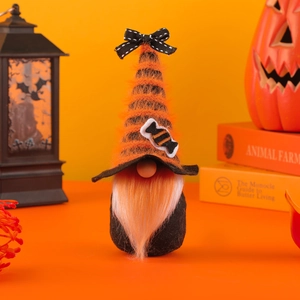 Halloween gnome plush with striped hat and candy accents on orange festive background