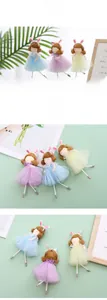 Close-up of three Easter fairy dolls in colorful tulle skirts and bunny ears