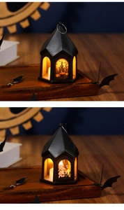 Macro detail of a black Halloween lantern with illuminated pumpkin and castle motifs