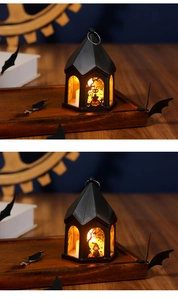 Detail of black Halloween LED lanterns with cat and pumpkin patterns on wooden table