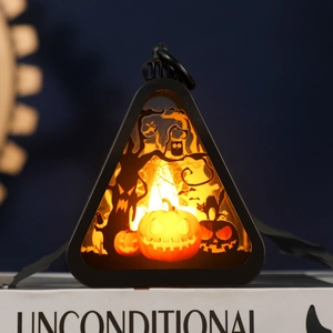 Halloween pumpkin lantern with LED light featuring spooky silhouette for home decor