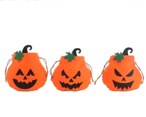 Three orange pumpkin drawstring bags with different expressions for Halloween candy treats