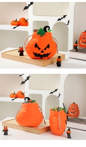 Detailed view of orange pumpkin drawstring gift bag with black sequin face and candies