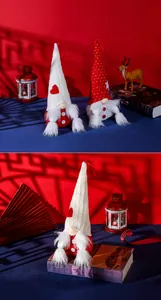 Detail of Christmas plush gnomes with knitted hats and white beards for festive decor